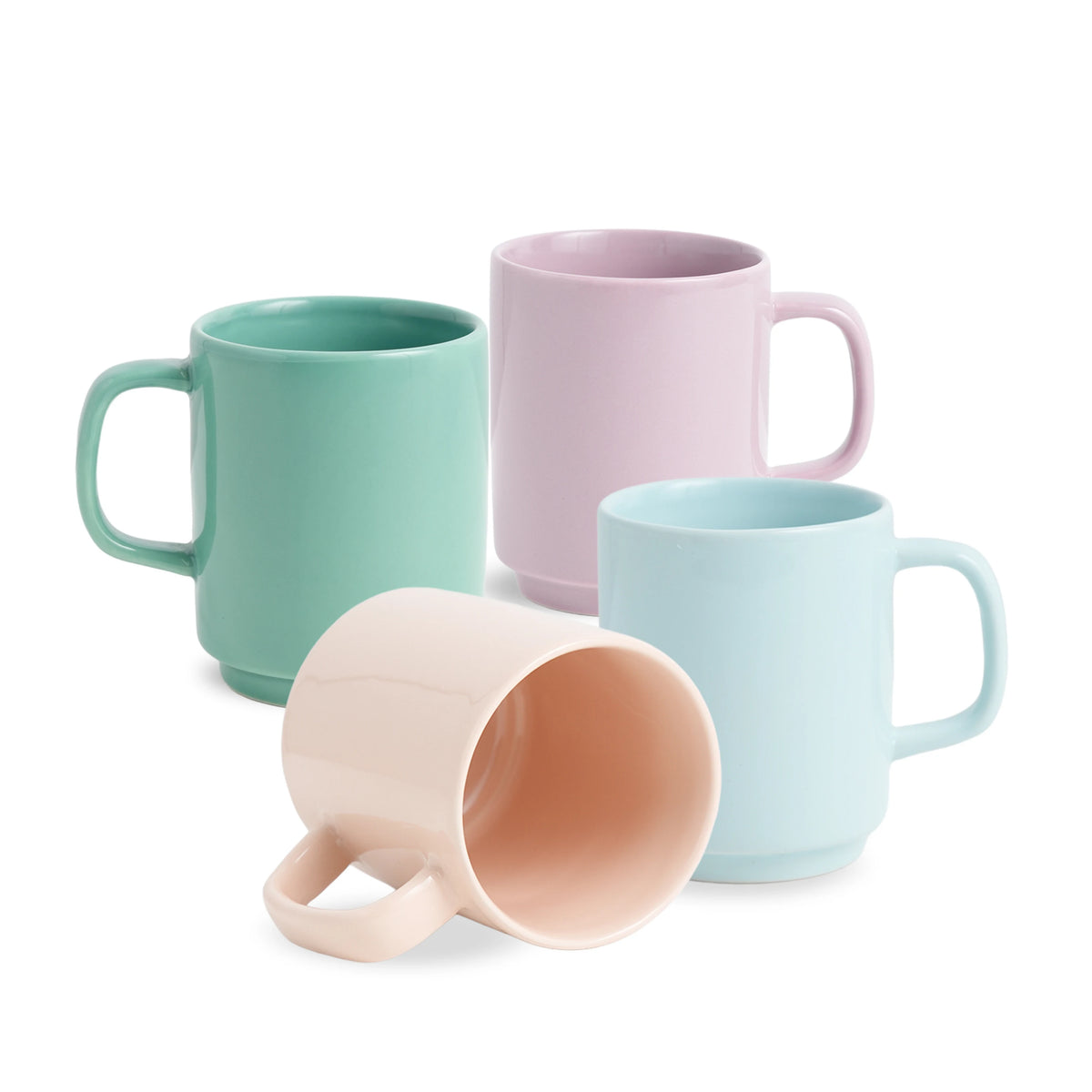 Four colorful mugs in pastel shades on a white background