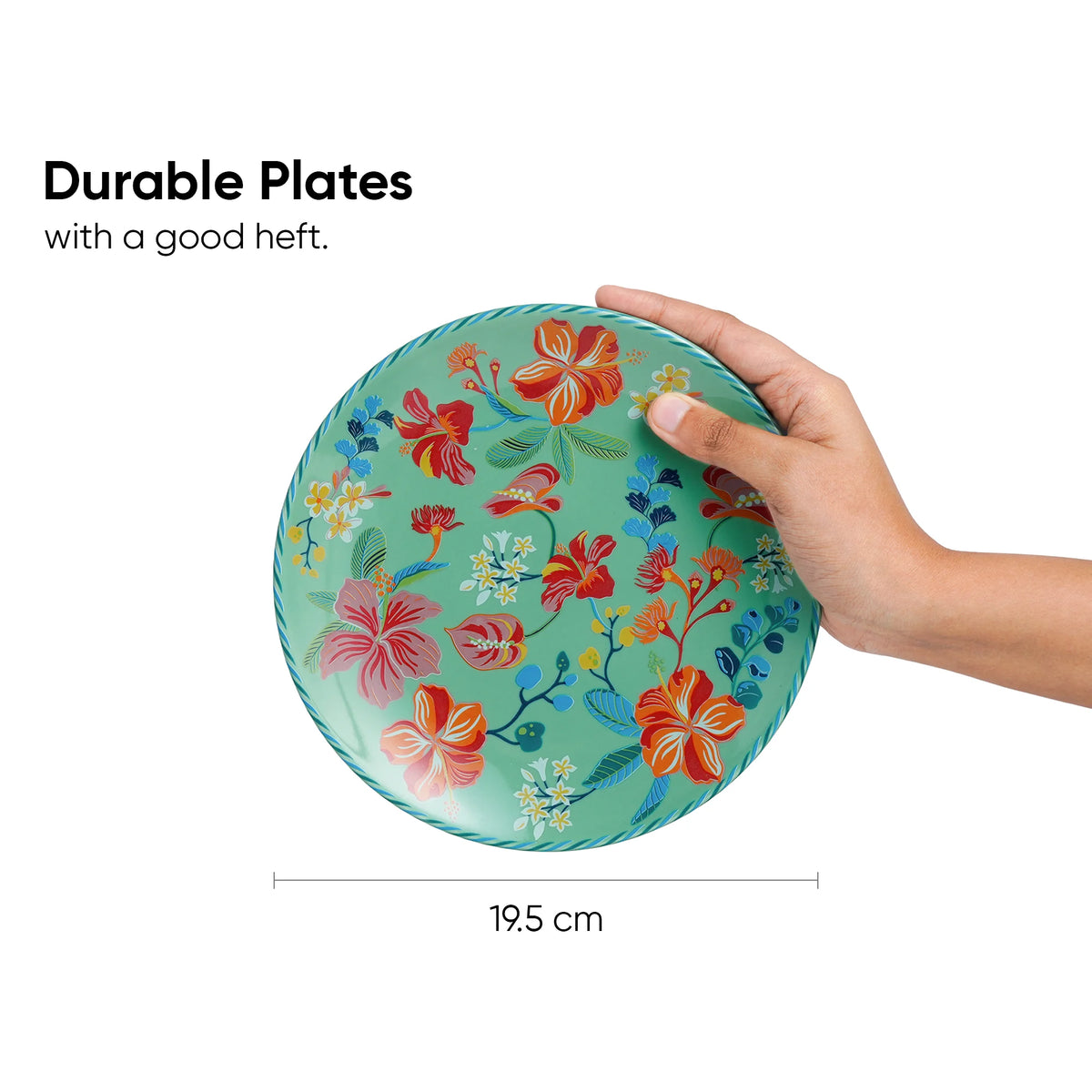 Hand holding a floral-patterned plate with text about durability and dimensions.