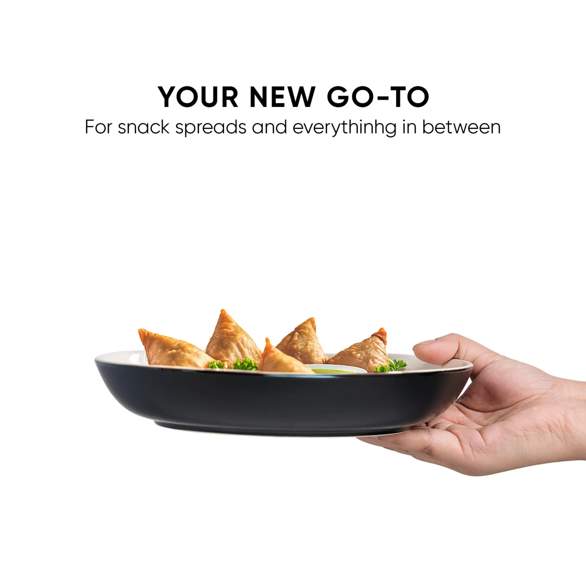 Hand holding a black plate with samosas and text 'Your New Go-To' on a white background