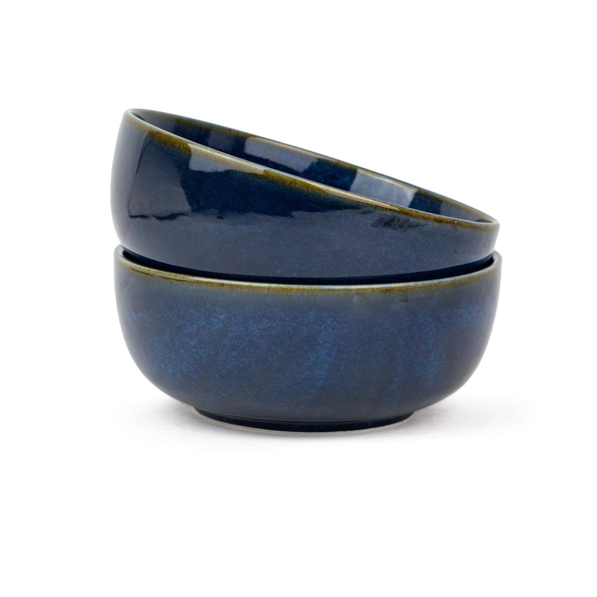 Two blue ceramic bowls stacked on a white background