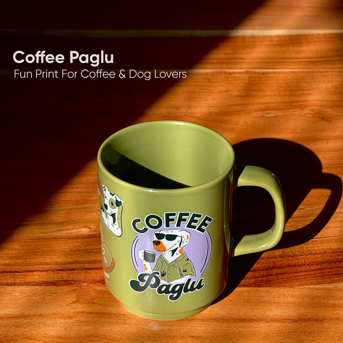 Green mug with 'Coffee Paglu' design on a wooden surface