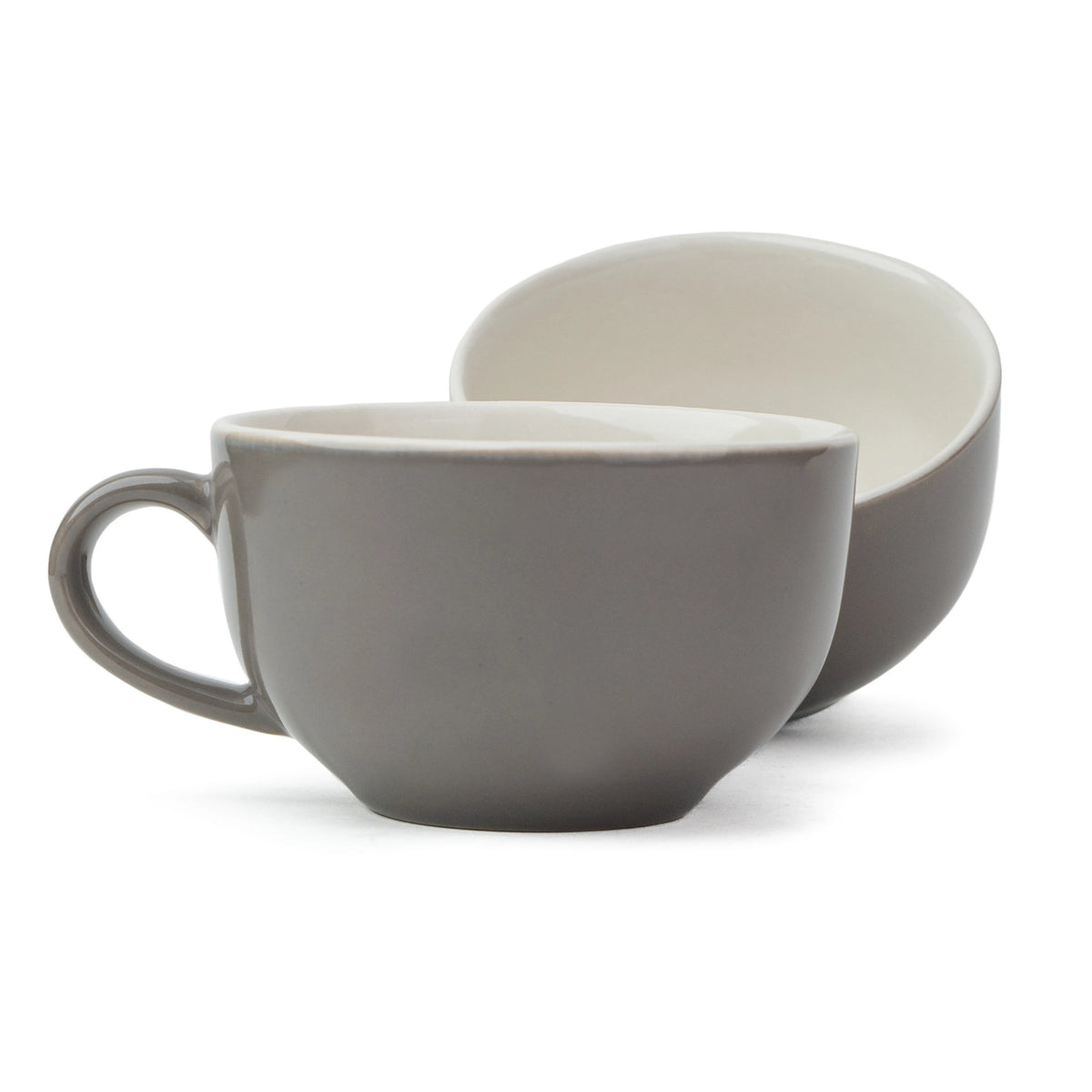 Two ceramic bowls, one gray and one beige, on a white background