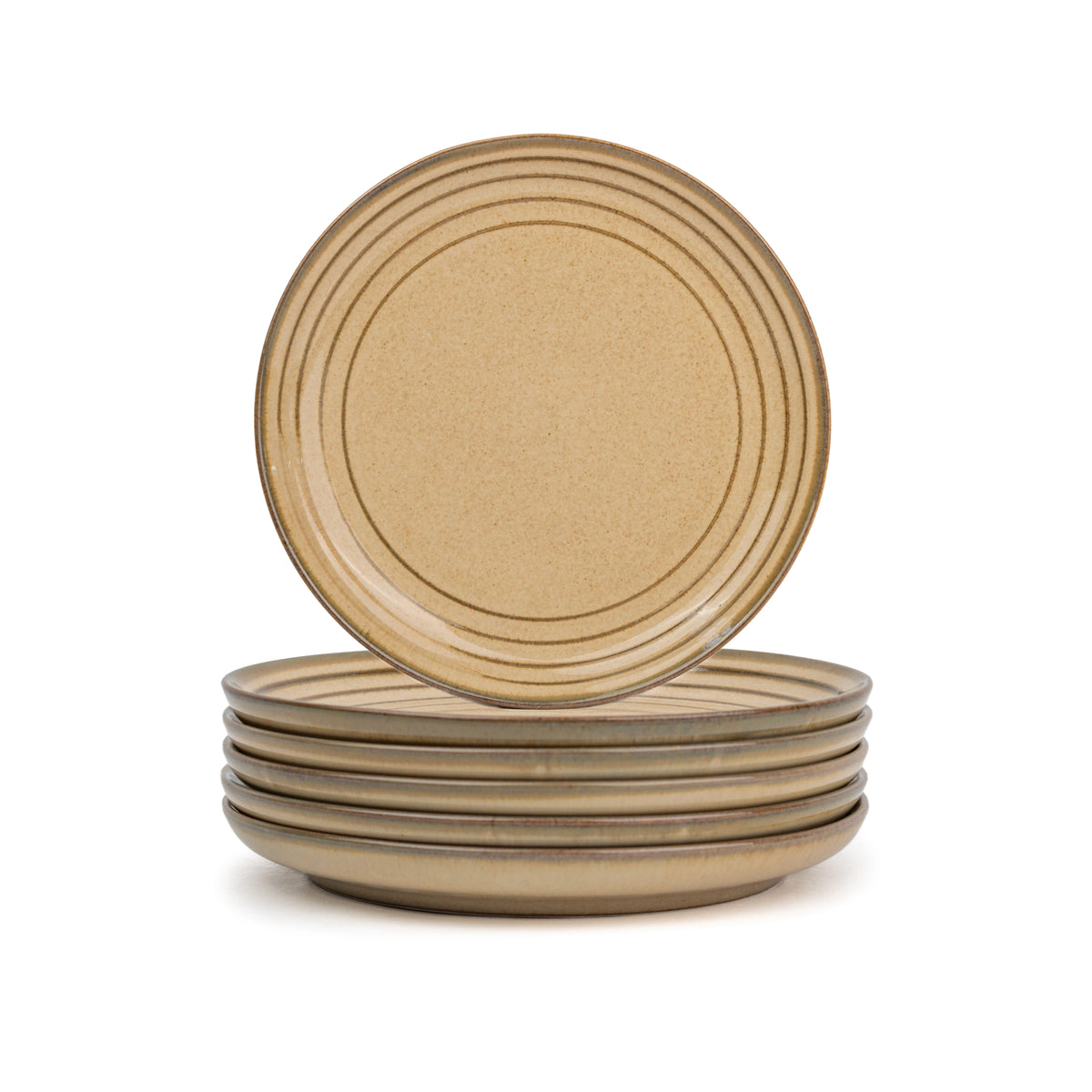 Set of four beige ceramic plates stacked on a white background