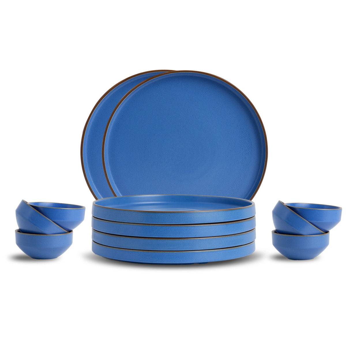 Set of blue ceramic dinnerware with brown rim on a white background