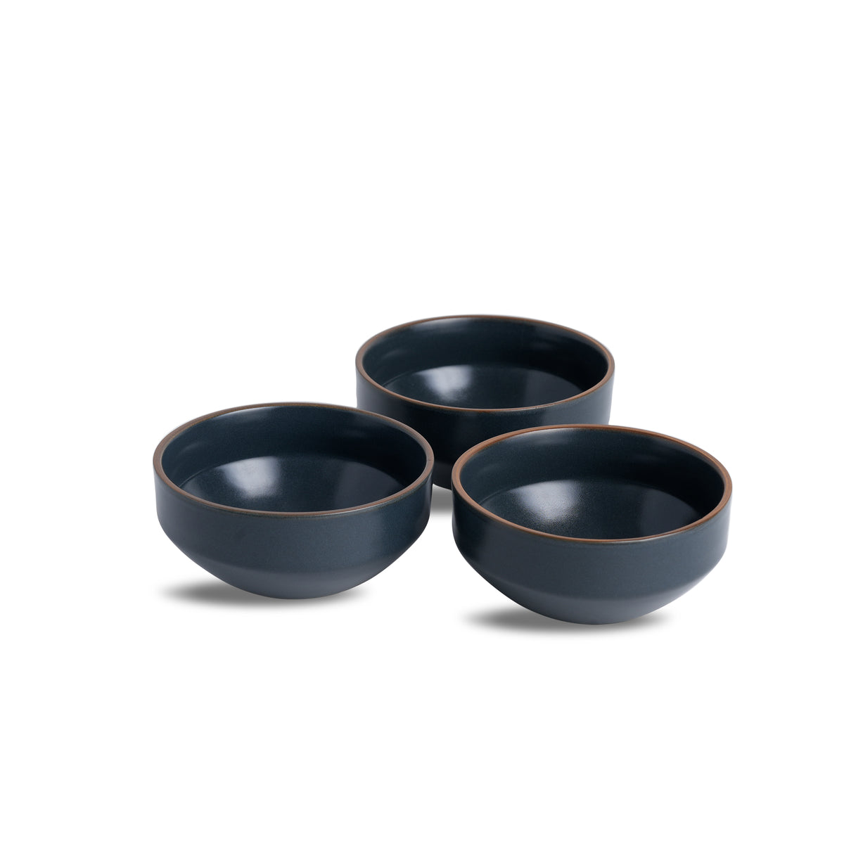 Three dark blue ceramic bowls on a white background