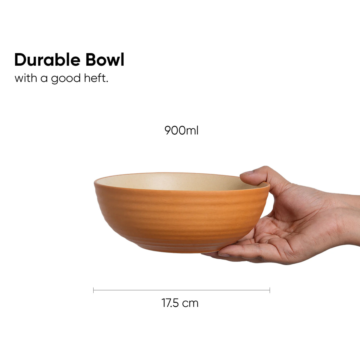 Hand holding a durable bowl with measurements on a white background