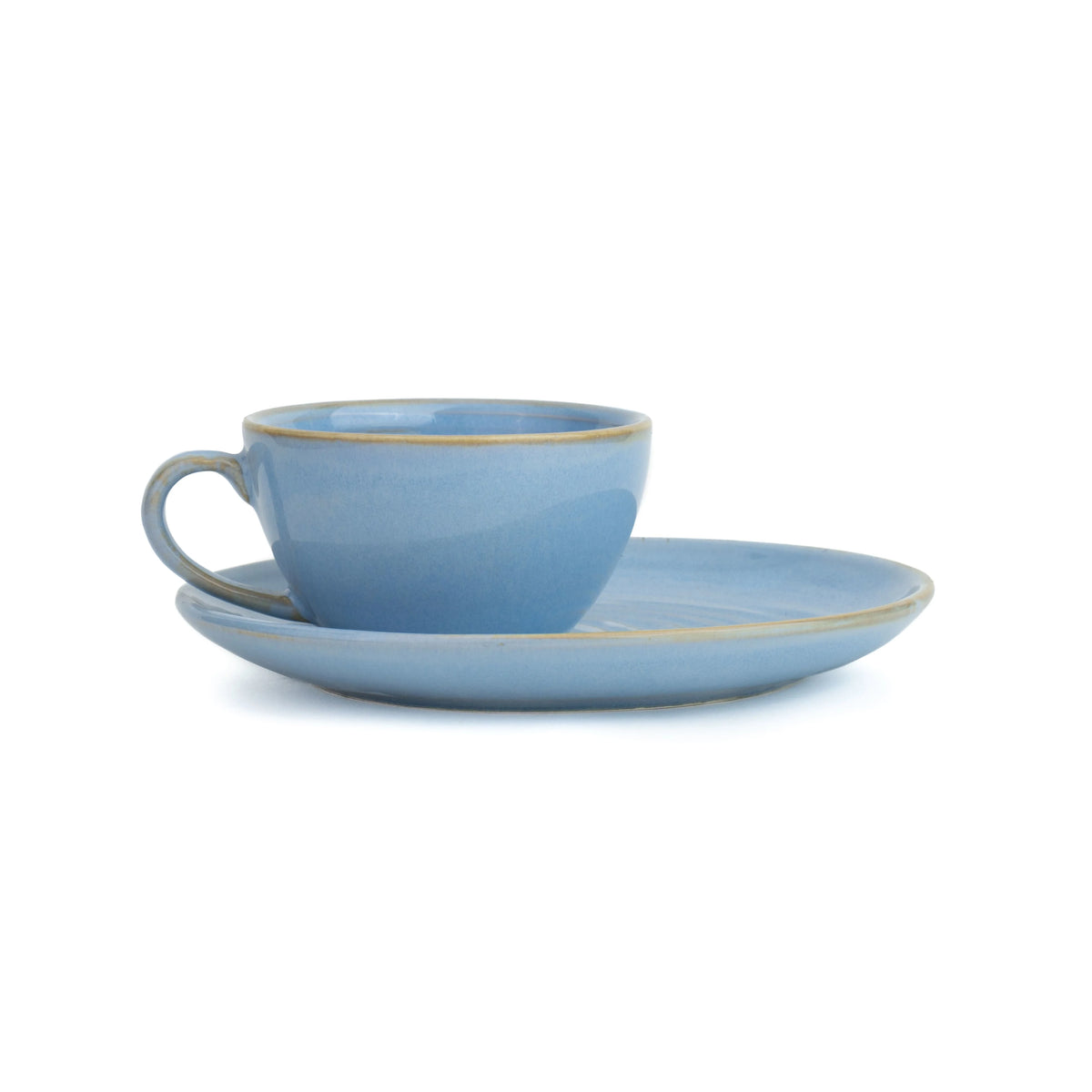 Blue ceramic cup and saucer set on a white background