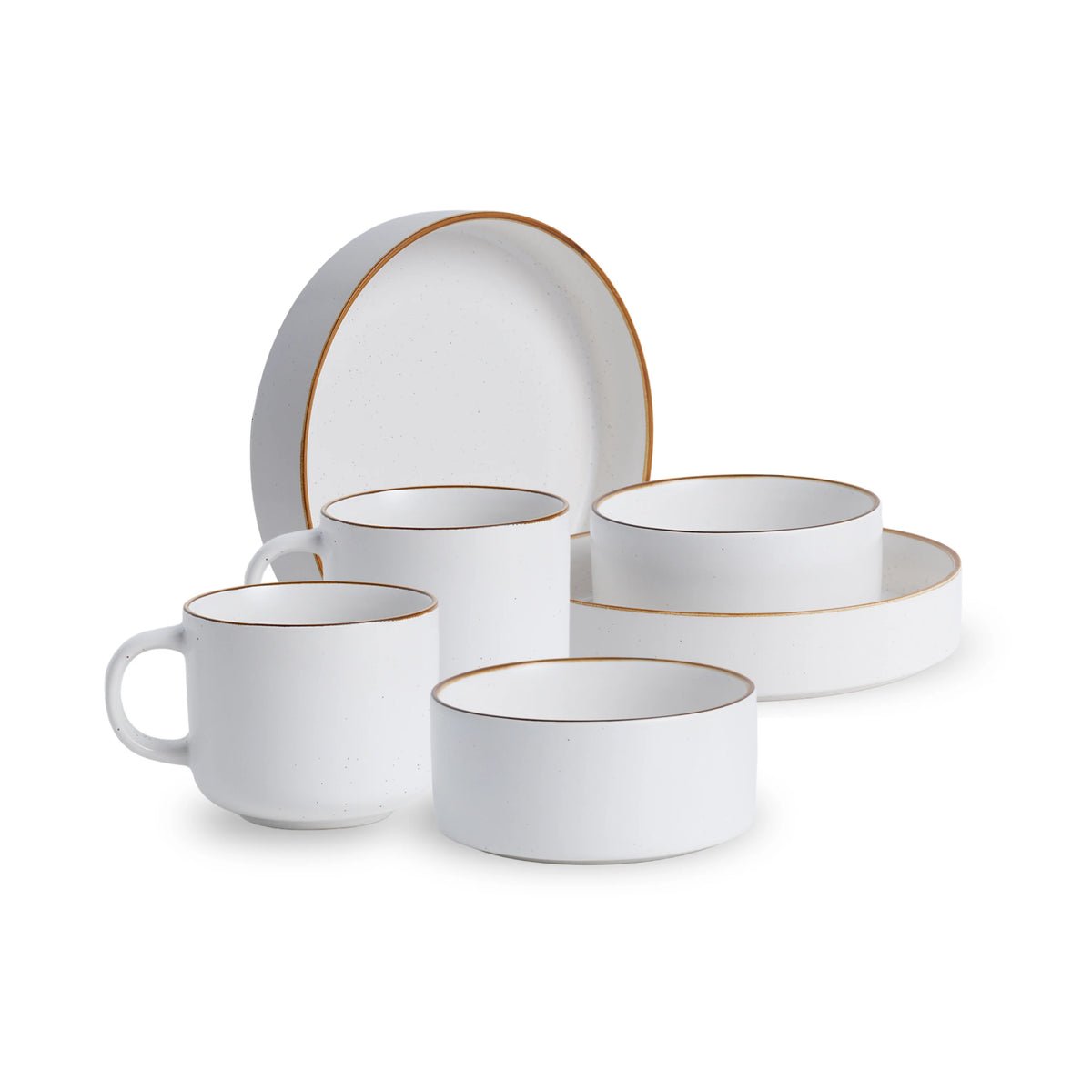 White ceramic dinnerware set with gold rims on a white background
