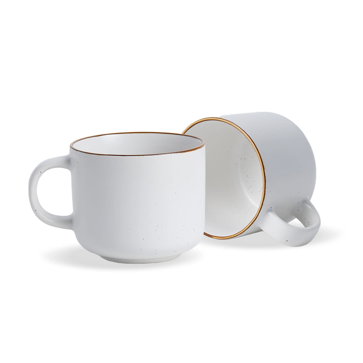 Two white ceramic mugs with gold rims on a white background