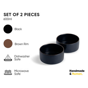 Set of two black bowls with brown rim on a white background, featuring product details and 'Handmade & Human' branding.