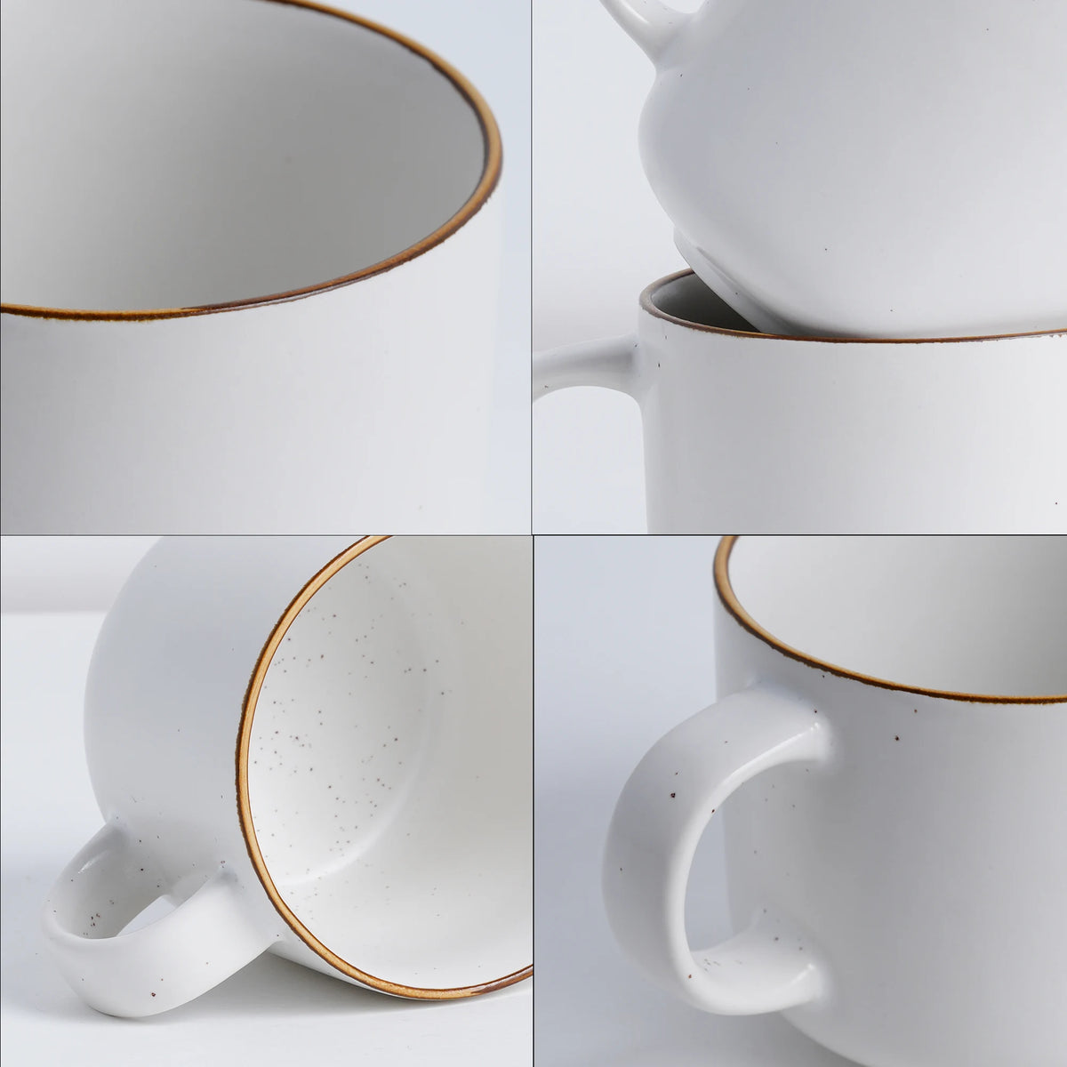 White ceramic mug with gold rim and handle on a light gray background