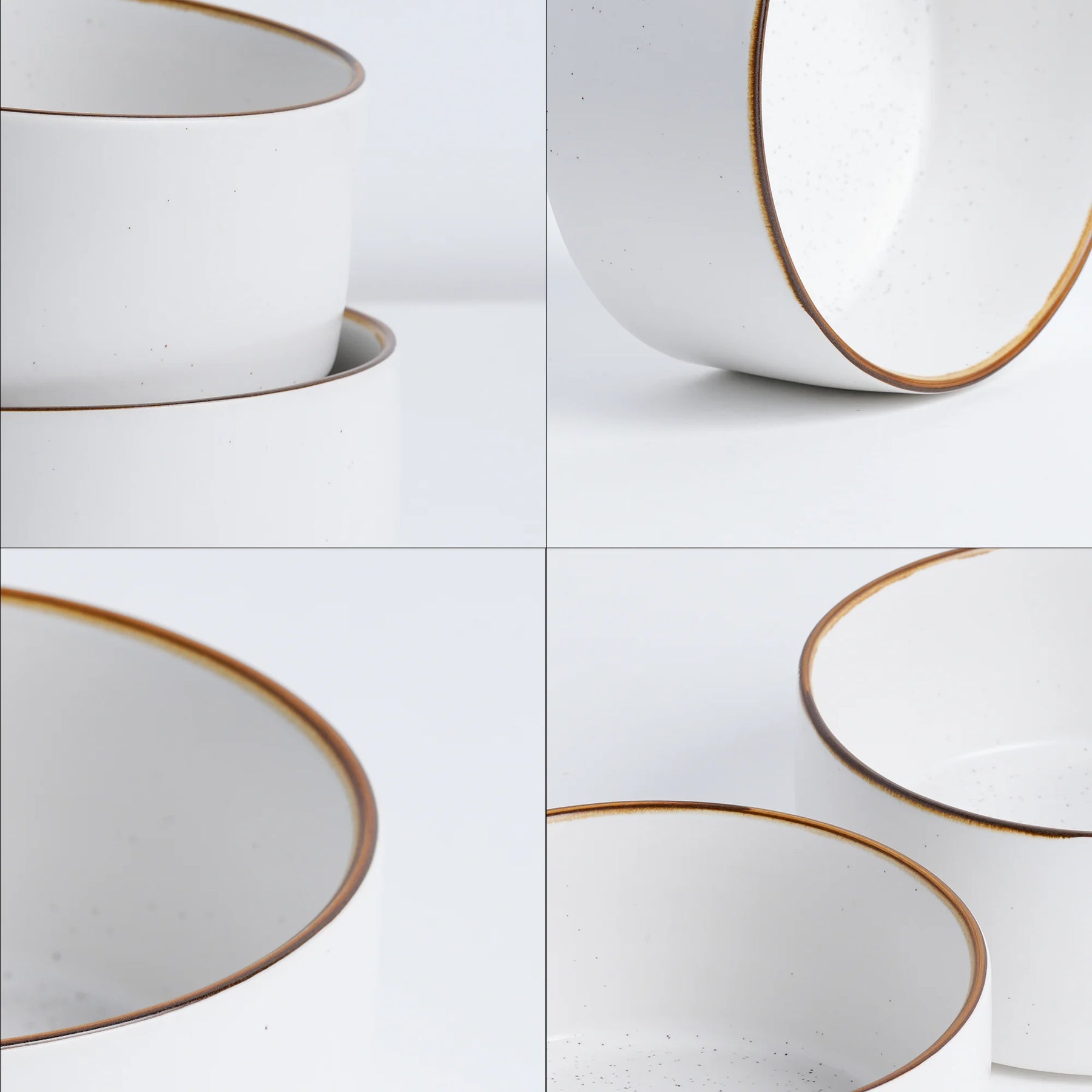 Set of white ceramic bowls with gold rims on a light gray background