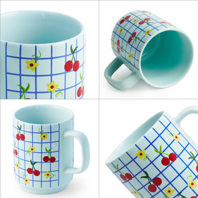 Set of four mugs with colorful patterns on a white background