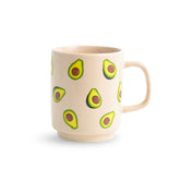Beige mug with avocado designs on a white background