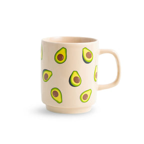 Beige mug with avocado designs on a white background