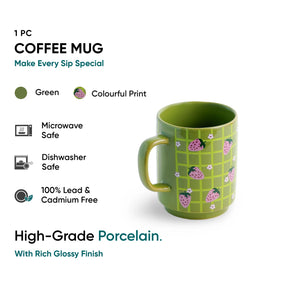 Green coffee mug with colorful print on a white background