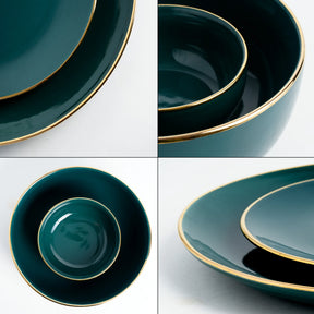 Set of green ceramic plates with gold rims on a white background