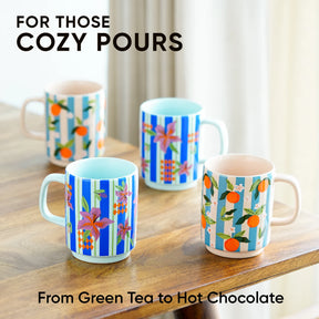 Colorful mugs with floral and striped patterns on a wooden surface.