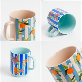 Set of four mugs with different patterns on a white background