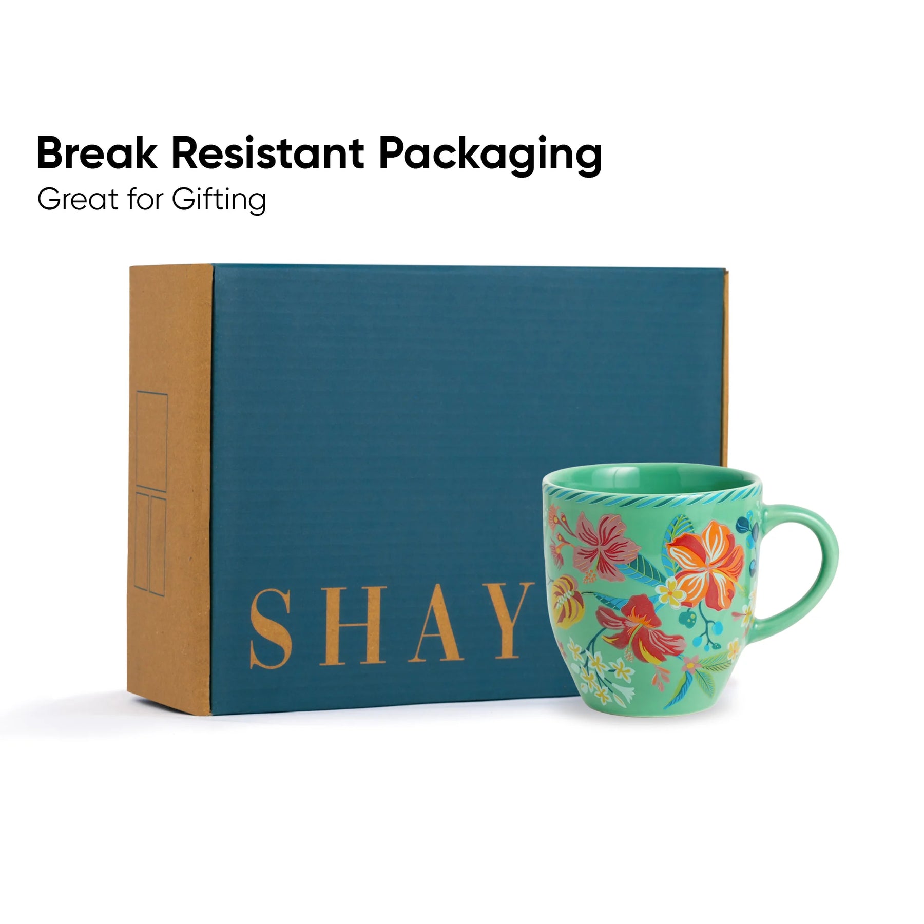 Floral mug with 'SHAY' branding next to a blue box labeled 'SHAY', with text 'Break Resistant Packaging Great for Gifting'.