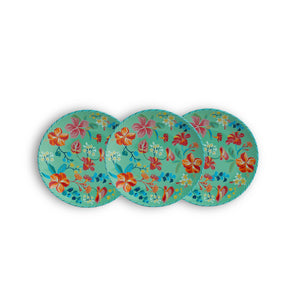 Three floral-patterned plates on a white background