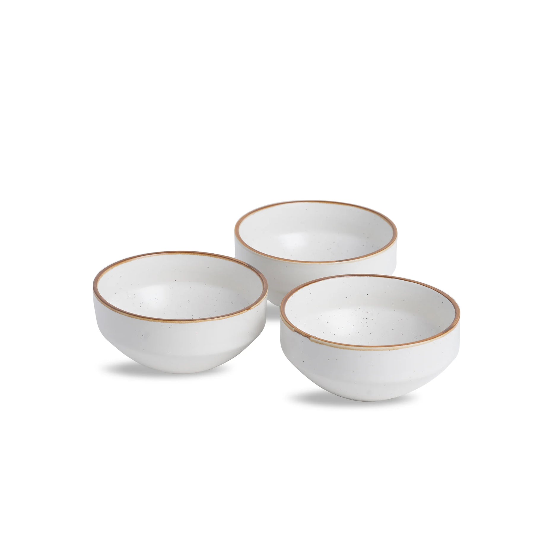 Three white ceramic bowls with gold rims on a white background