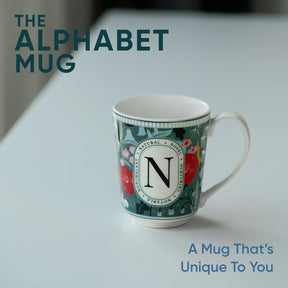 Decorative mug with letter 'N' on a light background, featuring text 'The Alphabet Mug'.