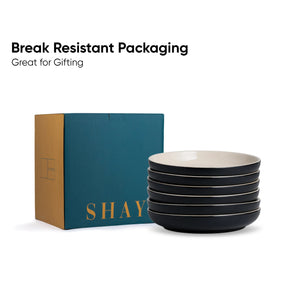 Stack of black bowls with 'SHAY' branding next to a teal box, on a white background.