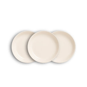 Three beige ceramic plates on a white background