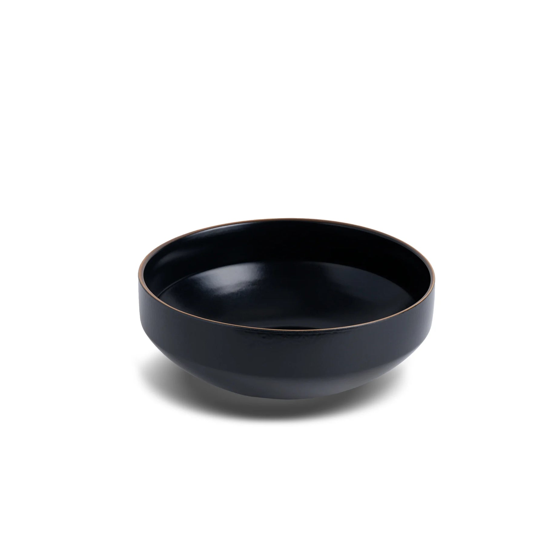 Black ceramic bowl on a white background