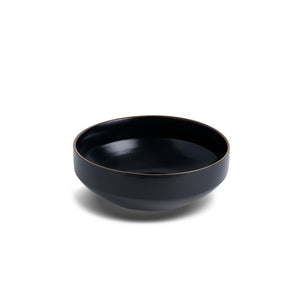 Black ceramic bowl on a white background