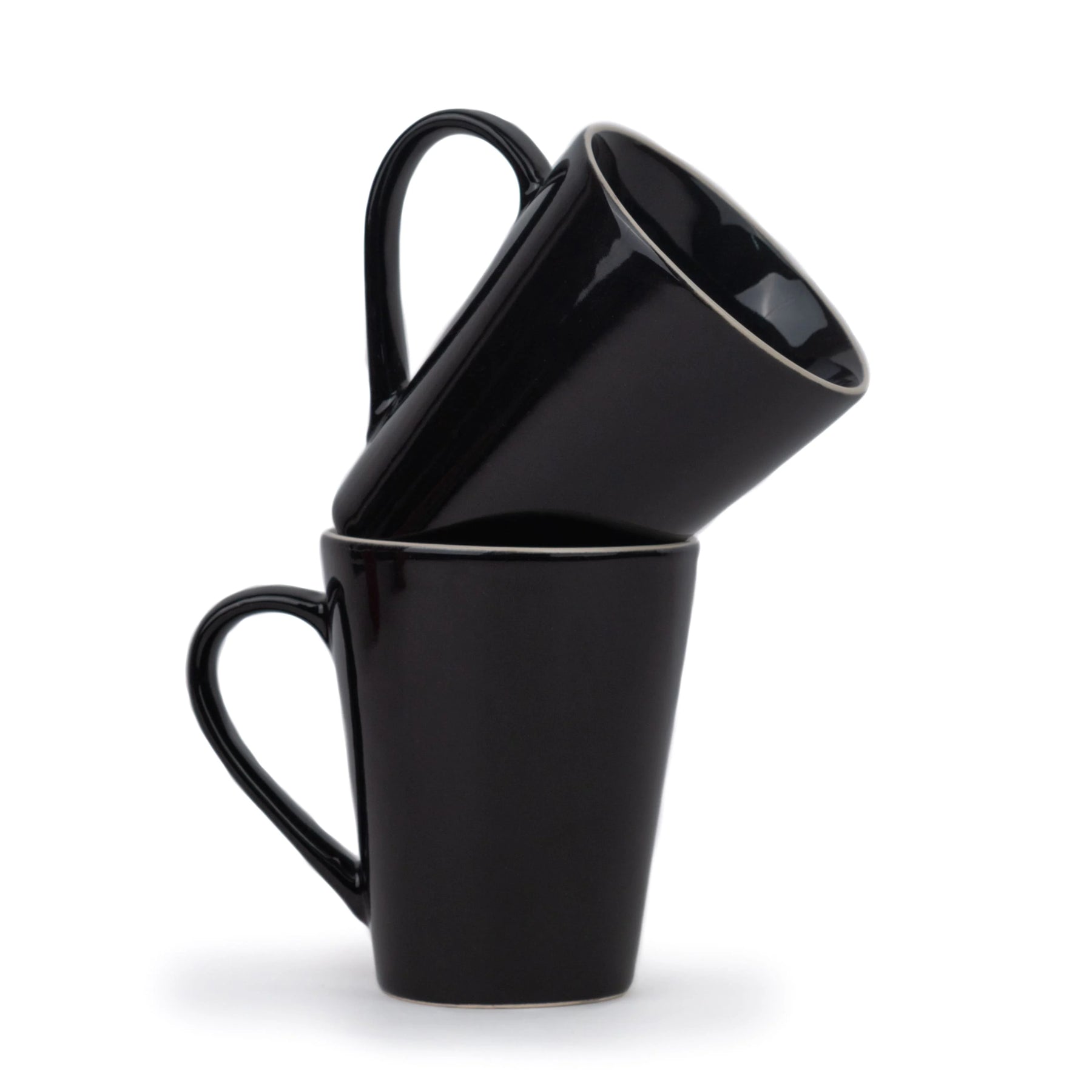 Three black mugs stacked on top of each other against a white background