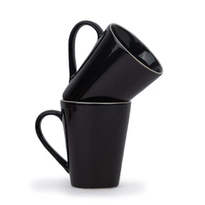 Three black mugs stacked on top of each other against a white background