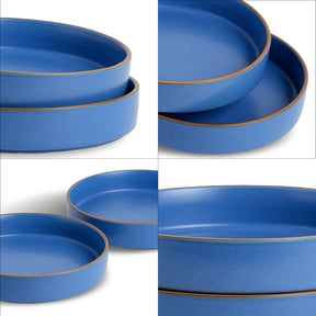 Set of blue ceramic plates with gold rims on a white background