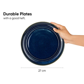 Hand holding a blue plate with text about durable plates and dimensions.