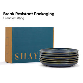 Stack of blue ceramic bowls with 'SHAY' branded box on a white background