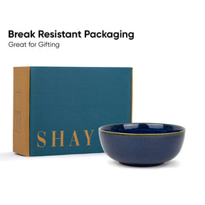 Blue bowl with 'SHAY' branding next to a teal box on a white background.