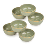 Set of five green ceramic bowls on a white background