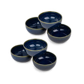 Set of five blue ceramic bowls on a white background