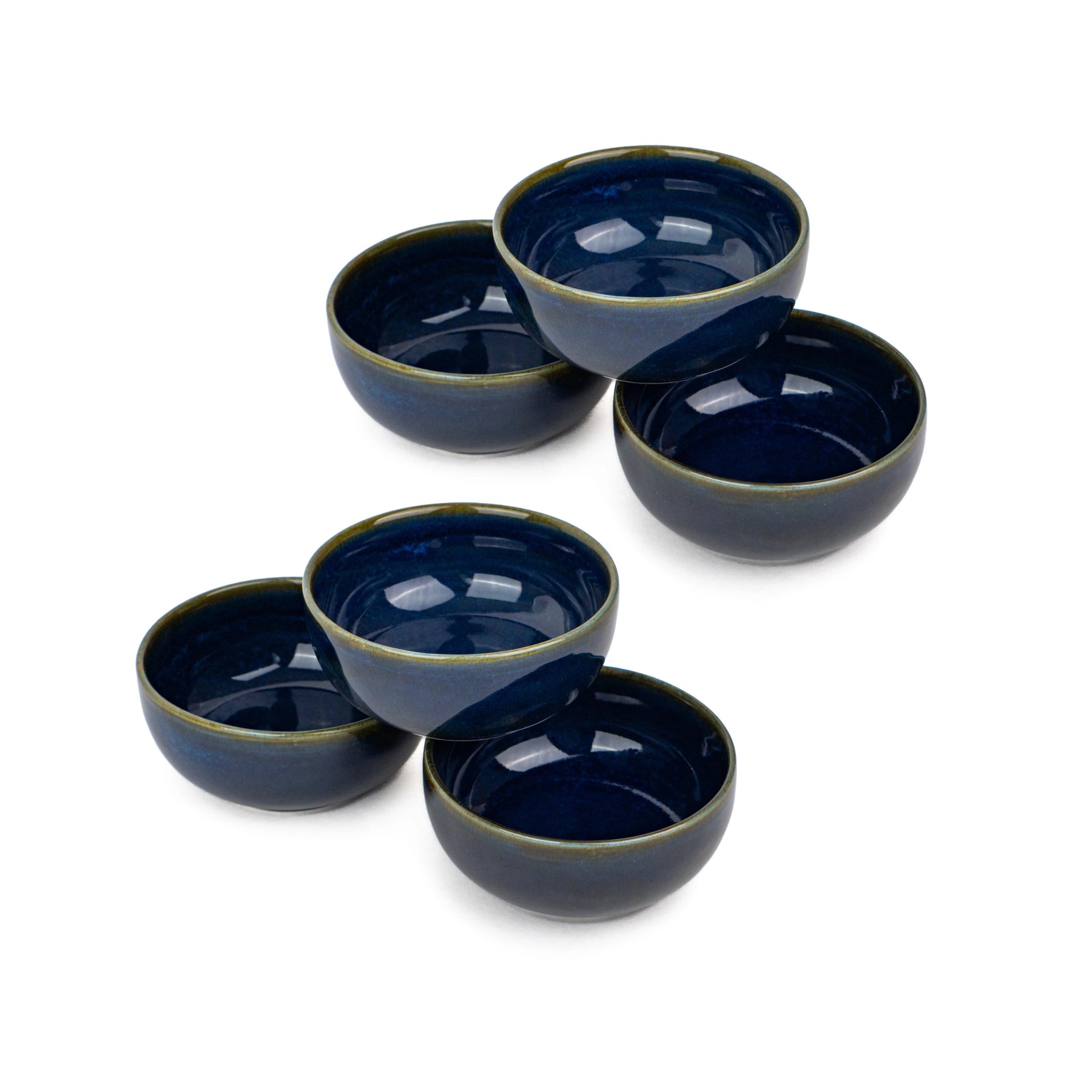 Set of five blue ceramic bowls on a white background