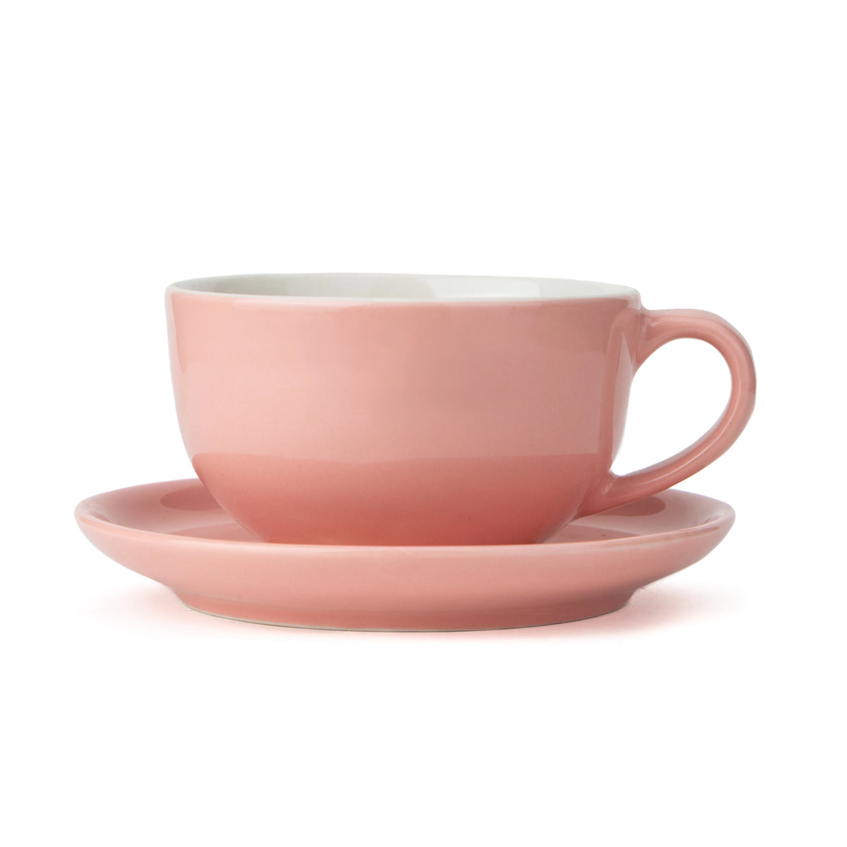 Pink cup and saucer set on a white background