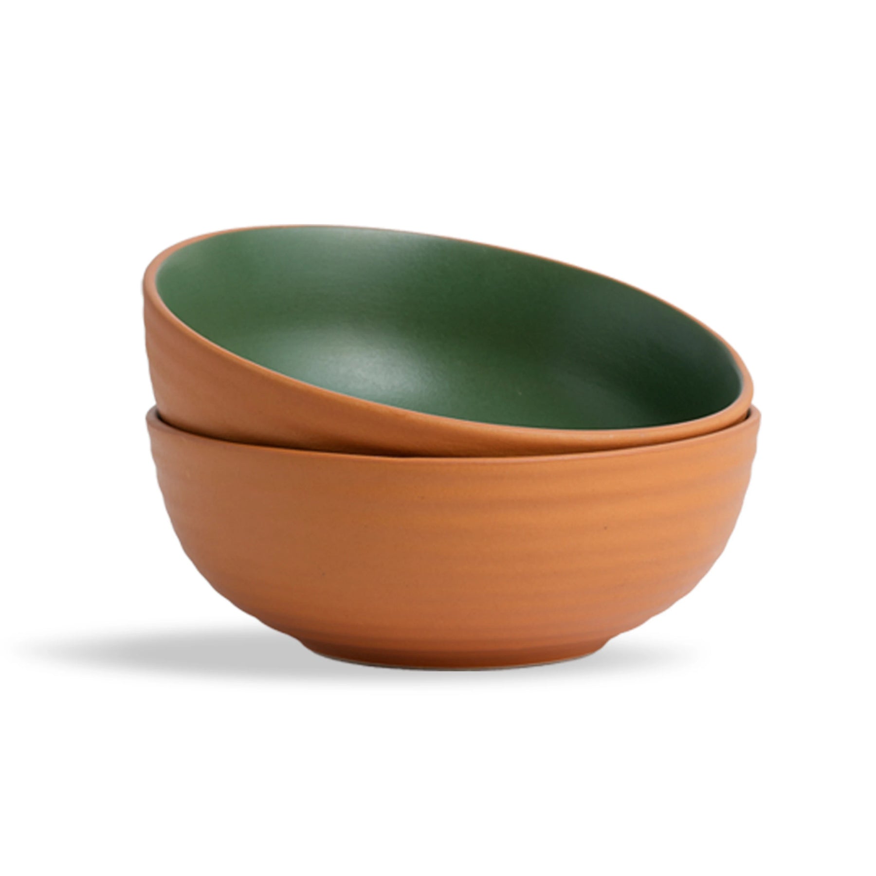 Two ceramic bowls, one green and one terracotta, stacked on a white background.