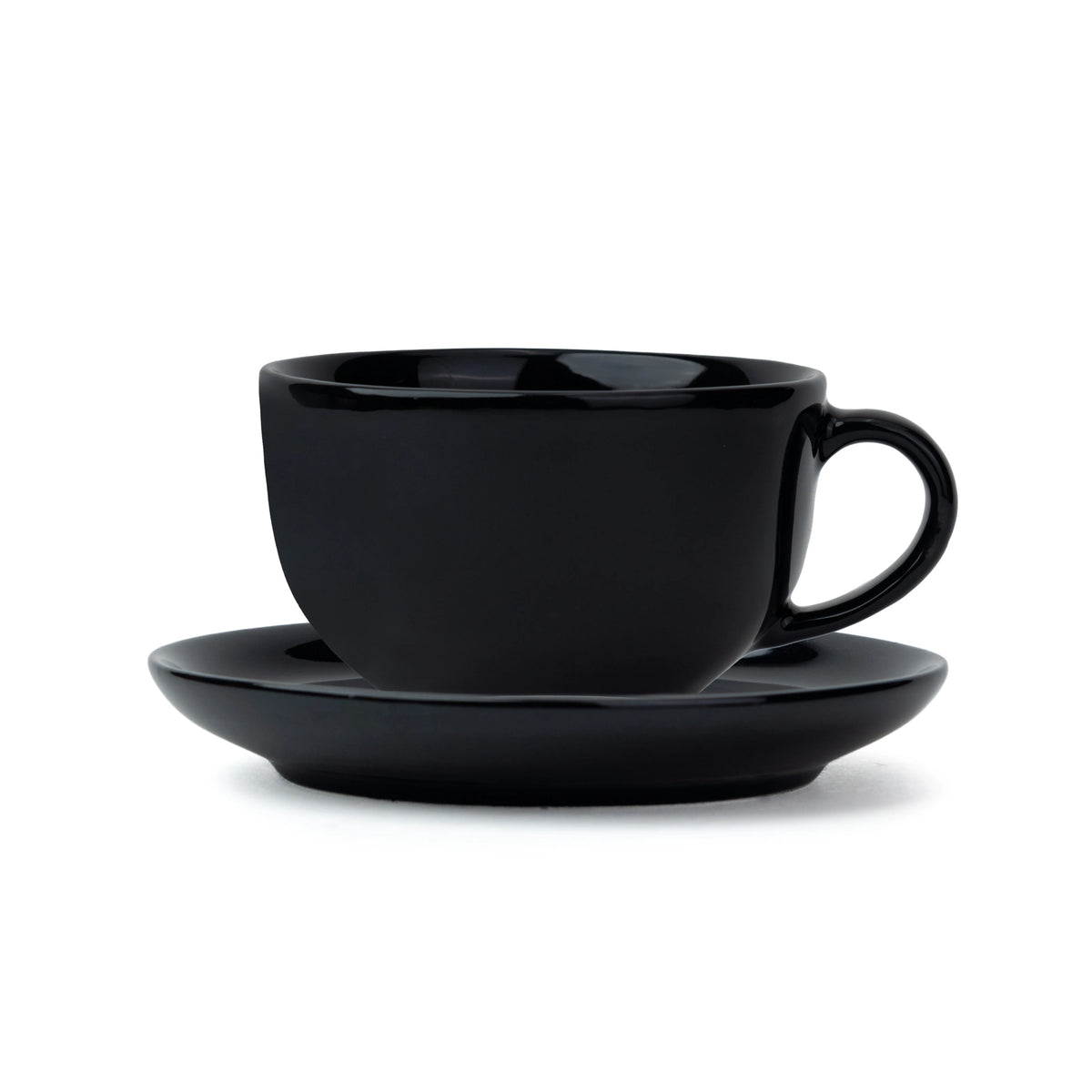 Black ceramic cup and saucer set on a white background