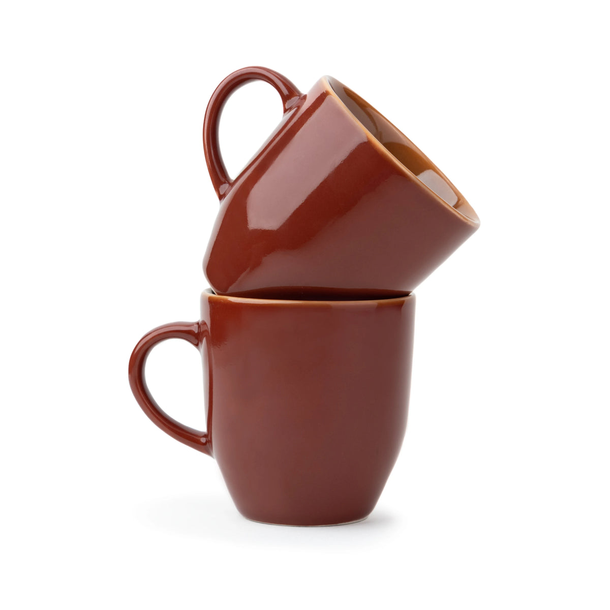 Two brown mugs stacked on a white background