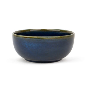 Blue ceramic bowl on a white background
