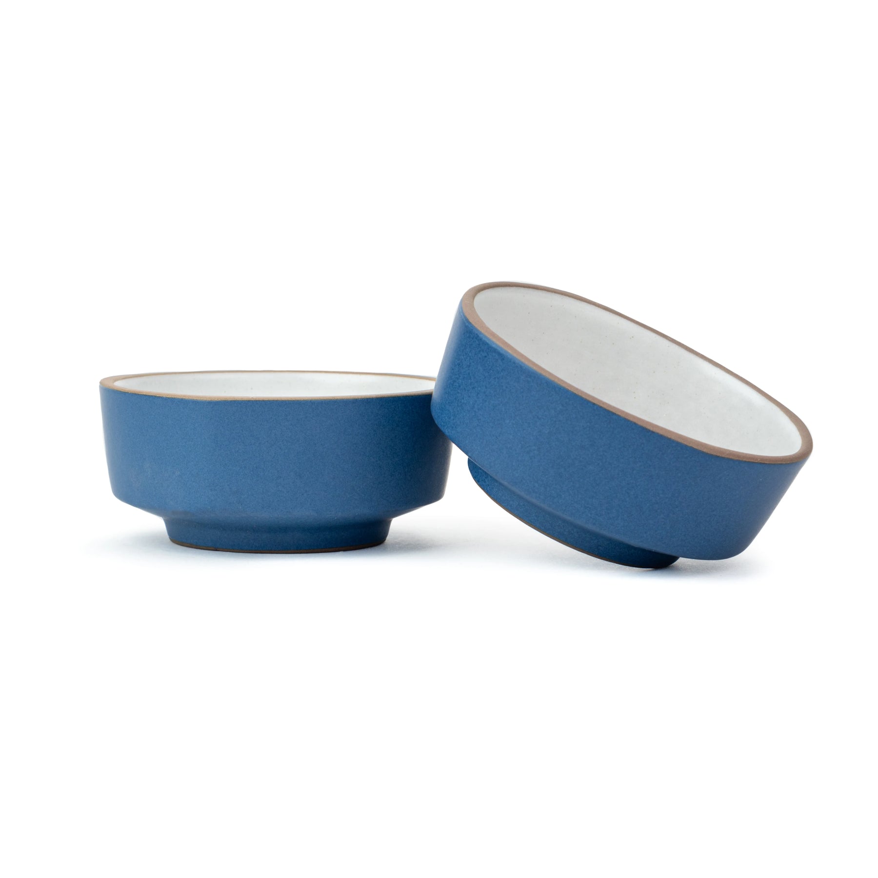 Two blue ceramic bowls on a white background