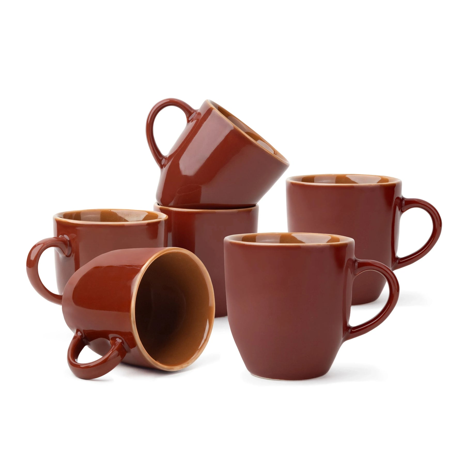Set of brown ceramic mugs on a white background