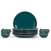 Set of teal ceramic plates and bowls with gold rims on a white background