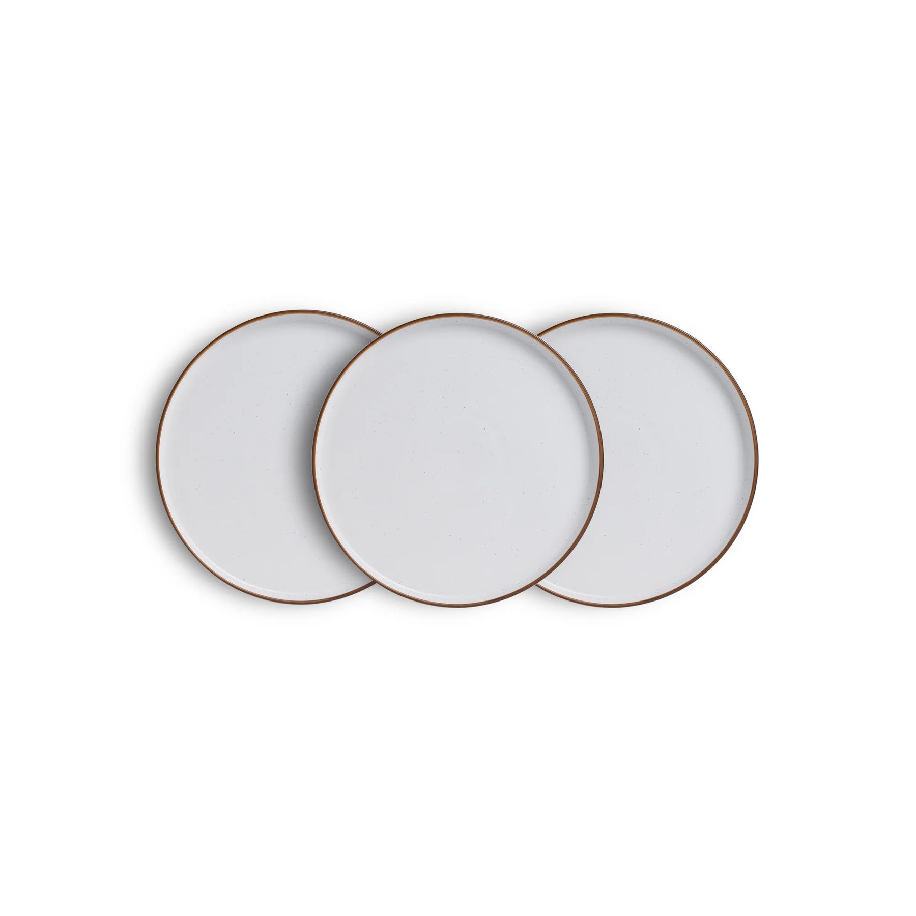 Three white ceramic plates with gold rims on a white background