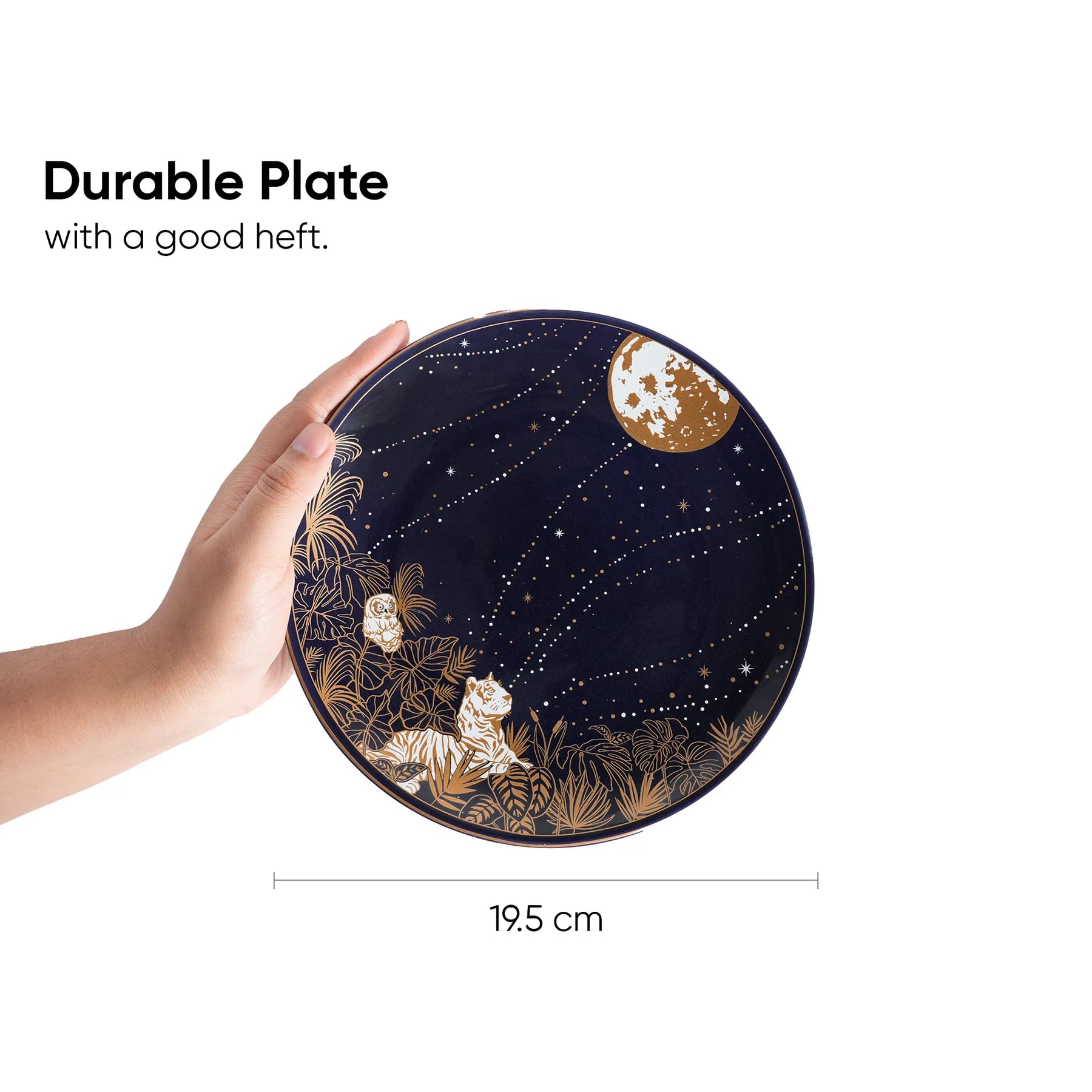 Hand holding a decorative plate with celestial design, text indicating durability and size.